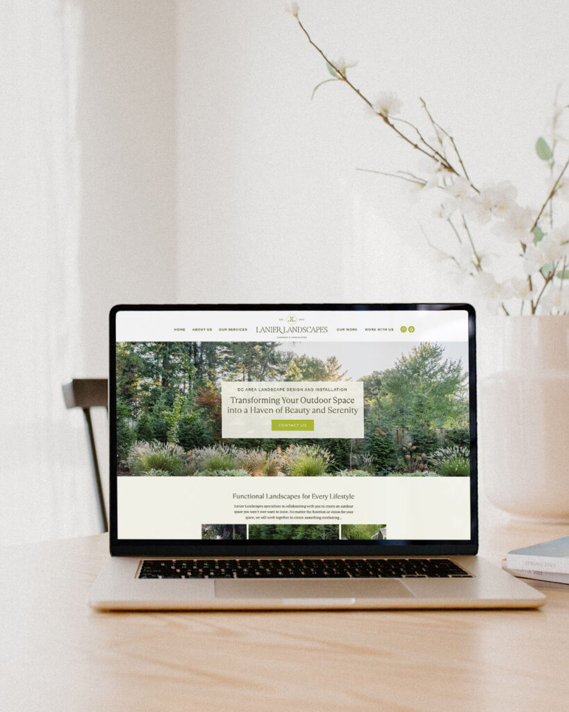 Website design for Lanier landscapes, computer sitting on kitchen table