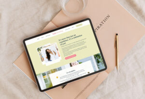 Kate Fleming senior photographer website shown on ipad green background of website sitting on table with linen cloth
