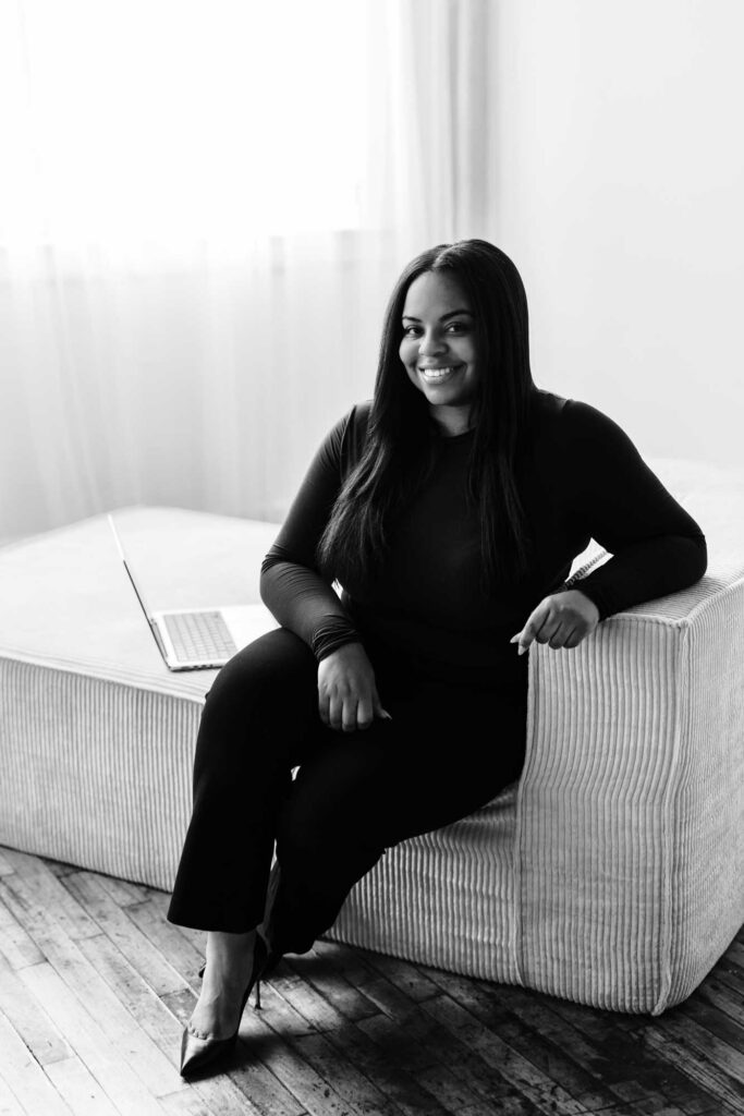 Lindsay of Lane Law sitting on white sofa 